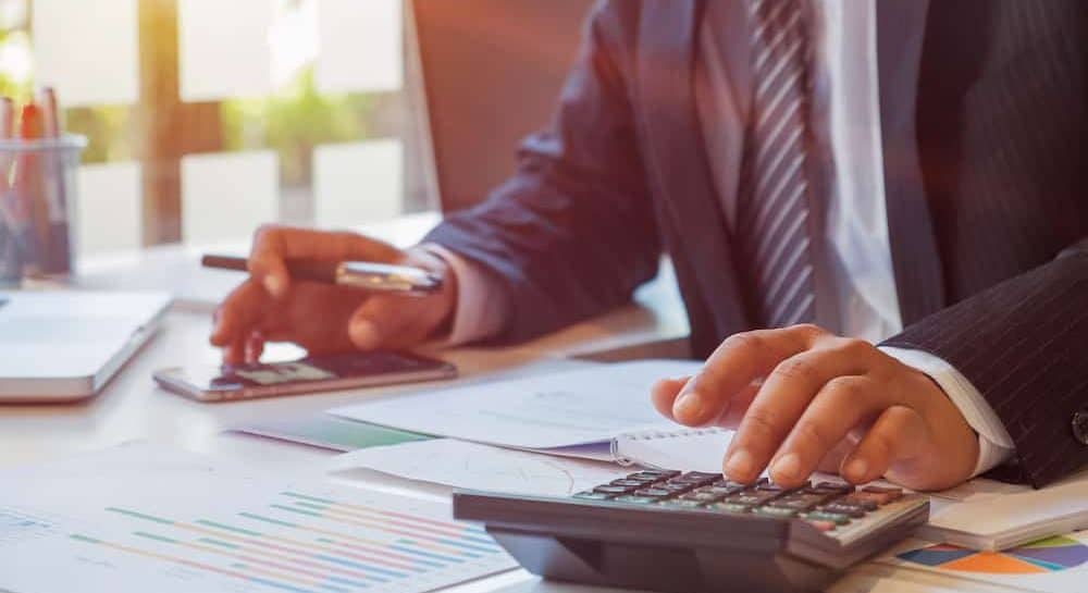 A financial advisor calculating budget numbers, Invoices and financial adviser working.