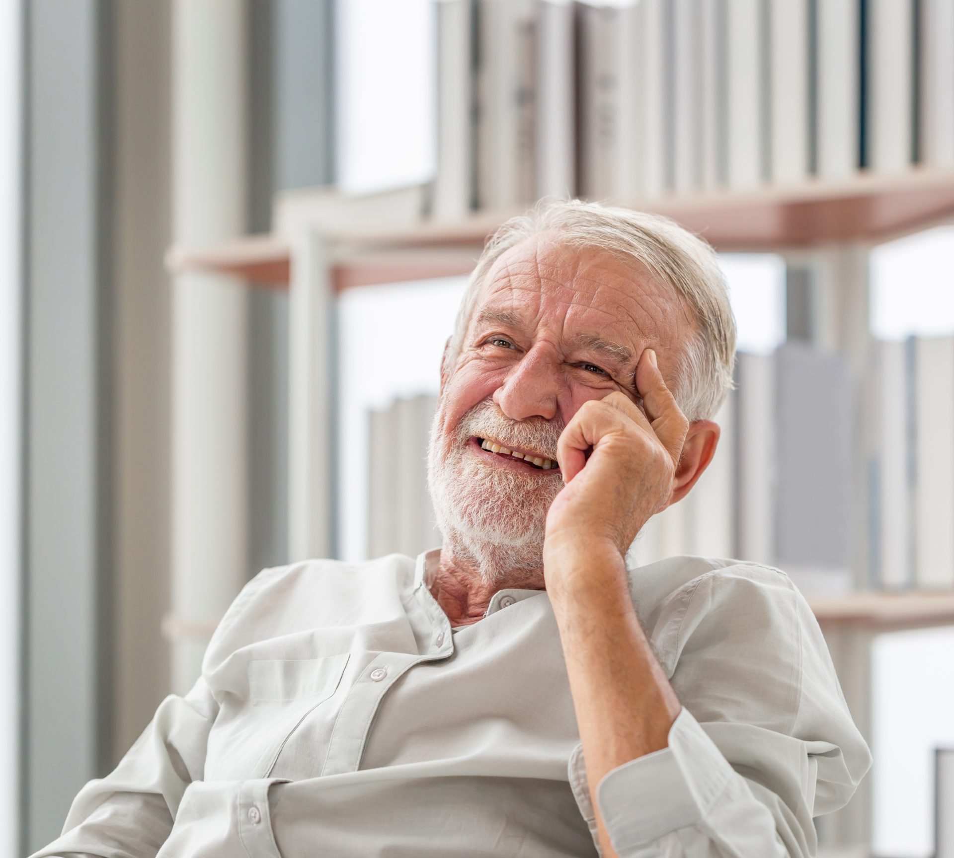 Portrait of smiling senior man relaxing and enjoying in living room