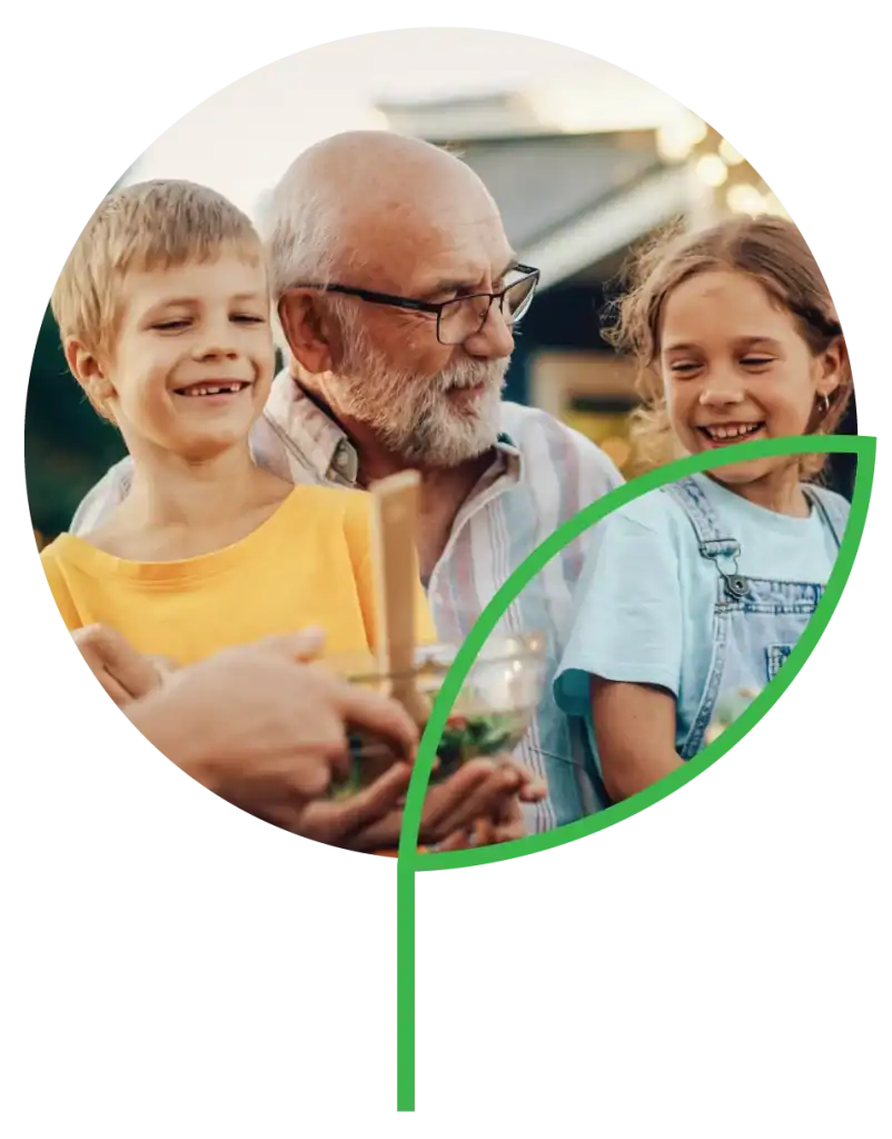 Grandpa and grandkids enjoying outdoor dinner